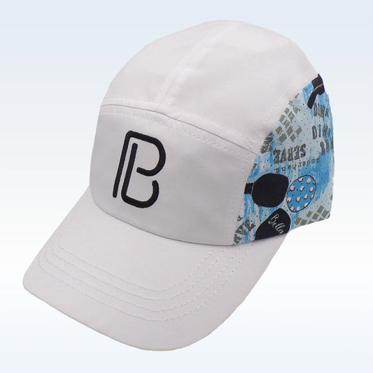 White baseball cap with blue and black pickleball-themed side panel showcasing a pickleball paddle and the word "dink."  Embroidered black "PB" logo displayed prominently on the front.