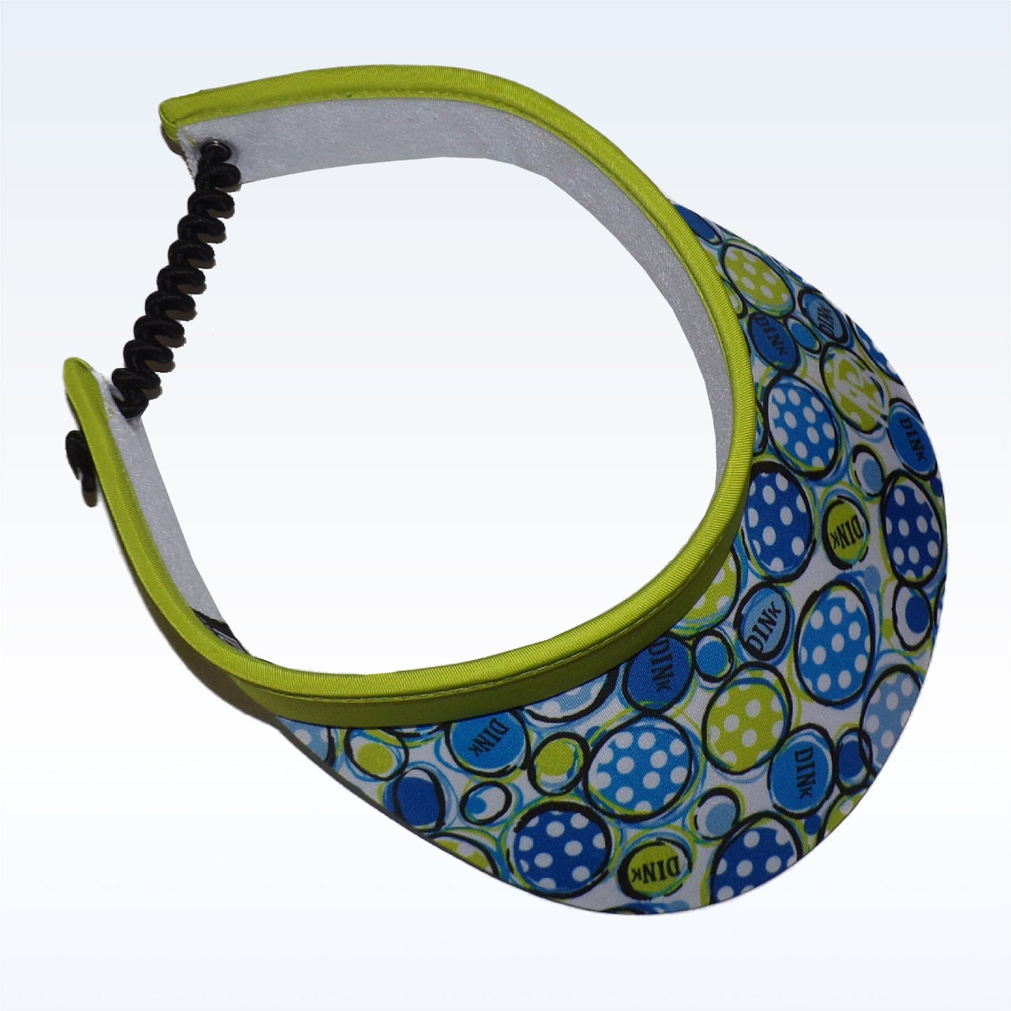 Blue and white polka dot visor with lime green trim displays "DINK" repeatedly on the brim.