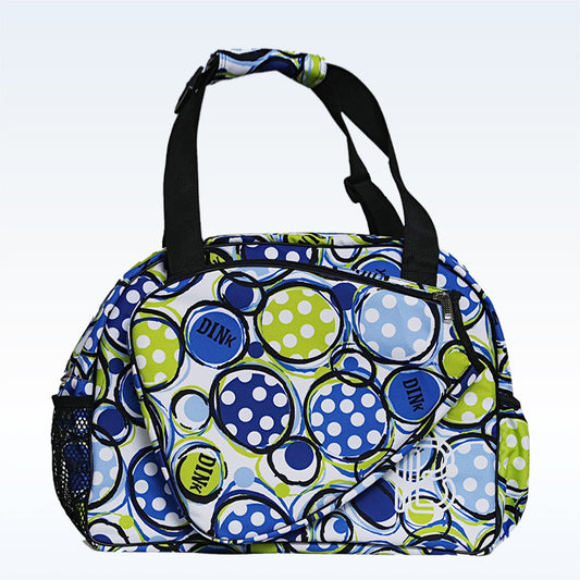 Blue and green polka dot pickleball bag with black accents and paddle-shaped pocket.