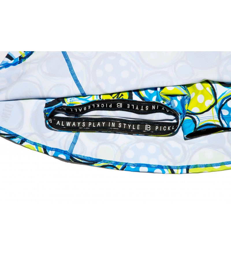 Blue and green pickleball athletic skirt waistband with "Always Play In Style" text.