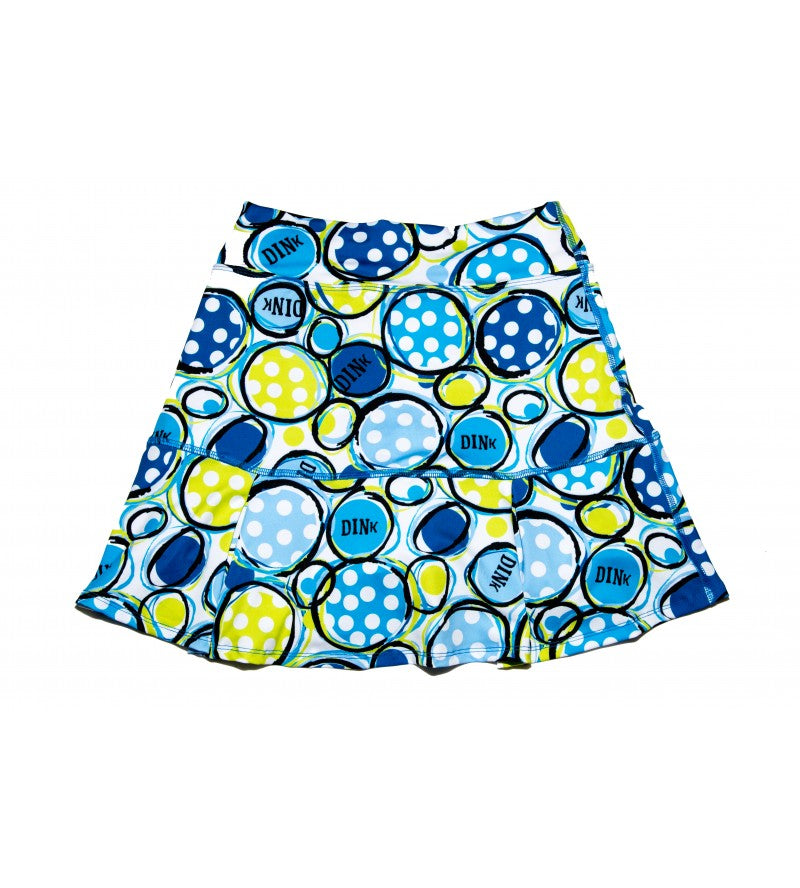Blue and white polka dot athletic skirt with yellow circle pattern and "DINK" logo print.