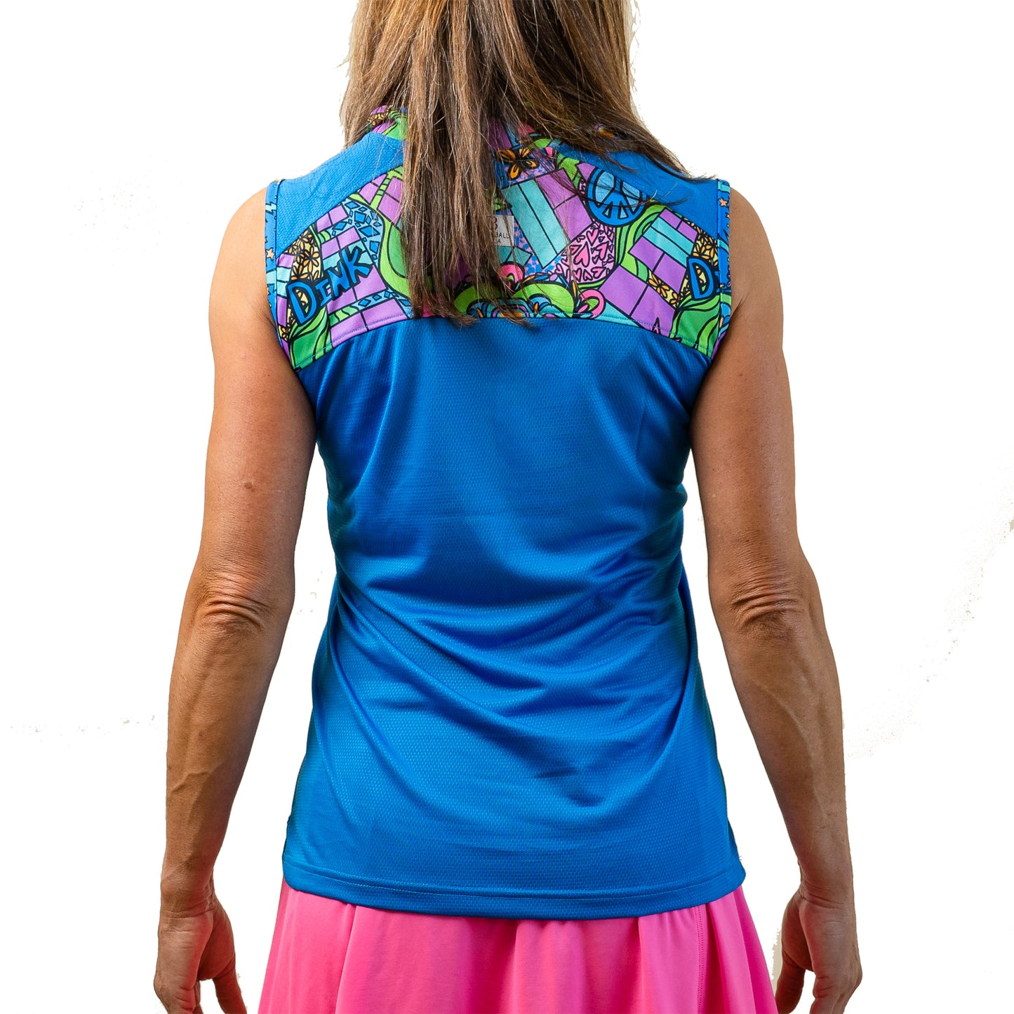 Woman models a blue athletic tank top with a colorful peace, love, and golf-themed design.