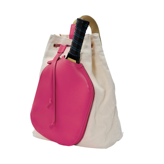 Canvas tote bag with hot pink side pocket holds a wooden paddle handle. 
